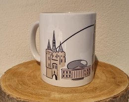 White ceramic mug with a graphic design of a castle and a bridge.