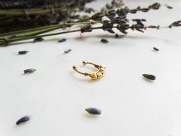 Golden hoop earrings with pearl accents, elegant and sophisticated accessory.