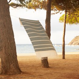 Fouta Ipanema - Beach and Hammam towel in various colors including duck blue, ocean blue, mustard yellow, candy pink, sahara, and emerald green. The towel features a striped design and is suitable for use at the beach or in the hammam.