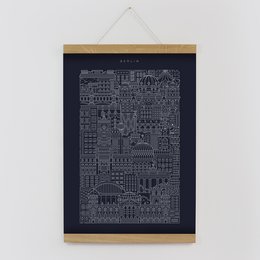 A black and white print featuring an abstract cityscape design with various architectural elements and shapes.