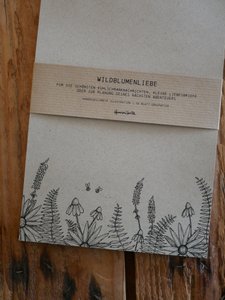 Grass paper notepad drawing wildflowers