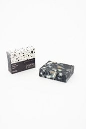 Handmade charcoal soap bar with a black and white speckled pattern.