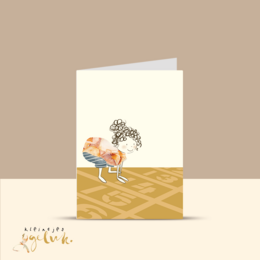 Greeting card with a whimsical illustration of a dinosaur on a sandy background.