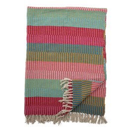 A cozy, recycled cotton throw blanket in a vibrant green, red, and pink striped pattern. The textured weave and fringe details add a rustic, handcrafted touch.