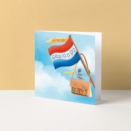 Colorful congratulatory card with Dutch flag and text "Hoera, geslaagd!" (Congratulations, you passed!)