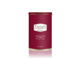A round, tall, red tin container with the Tahmis logo and text indicating it contains Ottoman Coffee with spices.