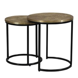 "Pair of round side tables with hammered brass-finished tops and black metal frames. Suitable for use as end tables or accent pieces in a living room or bedroom."