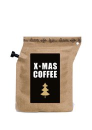  A bag of X-MAS COFFEE, a filter coffee product. The bag is made of burlap material and features a black and white Christmas tree graphic.