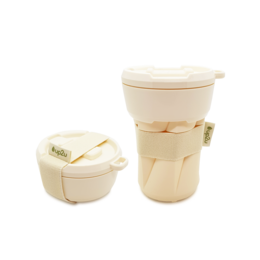Foldable, reusable vanilla-colored travel cup with a lid and carrying strap.