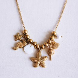 Beaded necklace with ‘Salt & Sea’ charms
