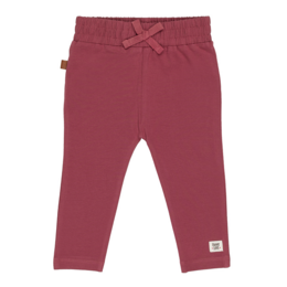 Soft, comfortable baby leggings in a warm burgundy color. Featuring an elastic waistband with a bow detail. Available in sizes 50/56 to 86.