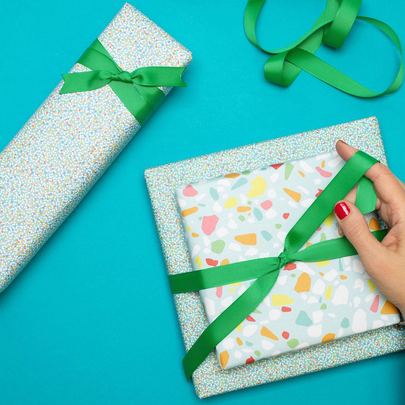 Colorful wrapping paper turquoise with terrazzo pattern, children pack gifts for children's birthday, for school or at birth