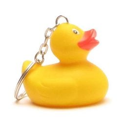 Turquoise rubber duck with a wave pattern design, suitable for use in a child's bath.