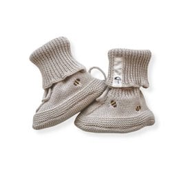 Beige knit baby booties with bee embroidery, soft ribbed cuff, drawstring closure, newborn shoes.