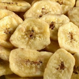 "Organic dried banana chips, golden yellow color, round flat slices, bulk 1.25kg package, natural sweetened snack"