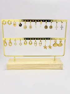 Lot 12 pairs of stainless steel earrings on offered display