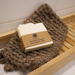  Goat hair bath glove with shea butter soap. Exfoliating gloves made of natural goat hair with a shea butter soap bar. Soft, textured material for gentle exfoliation.