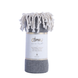Black and white diamond patterned hammam towel made of soft, absorbent cotton.