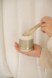 Exfoliating body polish with natural ingredients for soft, smooth skin. Contains orange peel and sea salt to gently remove dead skin cells.