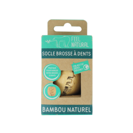 Natural bamboo toothbrush holder with carved leaf design.