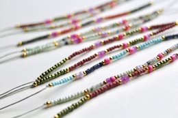 Colorful adjustable friendship bracelet with FSC card. Beaded bracelet with various materials and patterns. Suitable for gifting or personal use.