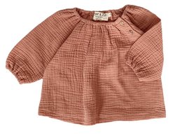 A baby and girls tunic in a terra color, featuring a loose, flowing design with puffed sleeves. The tunic is available in sizes ranging from 3 months to 4 years.
