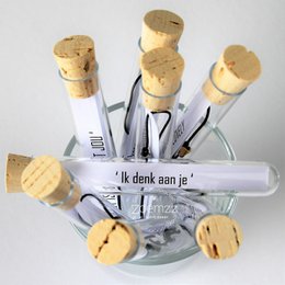  Charm bracelet with cork charms in the shape of tubes. The charms have the text "Ik dank aan je" printed on them, which means "I thank you" in Dutch.