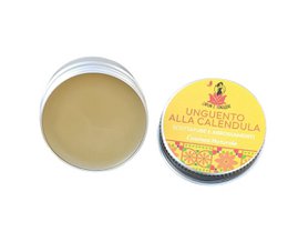 Calendula ointment, yellow cream, round tin container, natural healing balm, soothing skincare product.