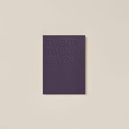  A dark brown journal with the text "TWENTY TWENTY SIX" embossed on the cover.