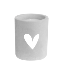 A round, white ceramic candle holder with a heart-shaped cutout design. The candle holder has a simple, minimalist style that would complement a variety of home decor styles.