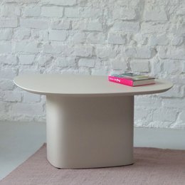 A medium-sized, oval-shaped coffee table in a variety of neutral and pastel colors including white, gray, beige, yellow, and blue.