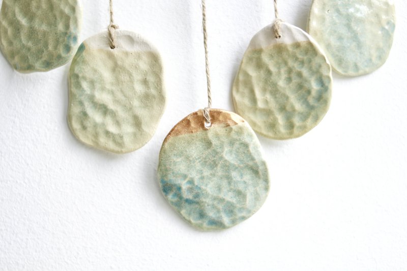 Bohemian wall hanger made of ceramic