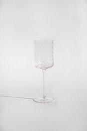  Set of 6 Naia wine glasses made of textured glass, suitable for serving red or white wine.