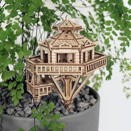 Wooden treehouse miniature kit, natural light wood color, architectural pagoda-style design, DIY craft assembly project.