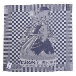 A black and white image of a tea towel featuring the Verkade's Biscuits logo and a stylized illustration of a young girl. The tea towel appears to be made of a checkered pattern fabric.