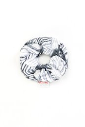 Silke Scrunchie "White Zebra" print