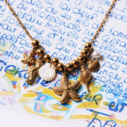 Beaded necklace with ‘Salt & Sea’ charms