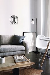 Metal wall art depicting the Vitruvian Man, a famous anatomical drawing by Leonardo da Vinci. The artwork features the iconic figure in a geometric, minimalist style.