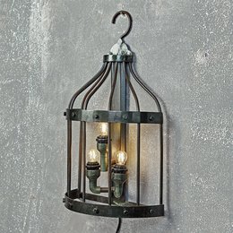  Decorative bird cage-shaped wall light with 3 candle-style bulbs, made of black metal frame and glass panels.
