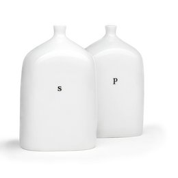 Two white ceramic vials labeled "S" and "P" for salt and pepper. The vials have a simple, minimalist design.