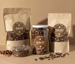Organic granola coffee nut - a blend of roasted coffee beans, nuts, and granola in various packaging sizes.