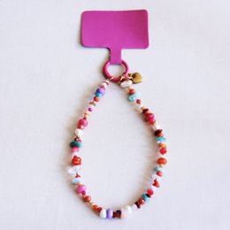 Stainless steel earrings with heart-shaped charms in pink and gold colors.