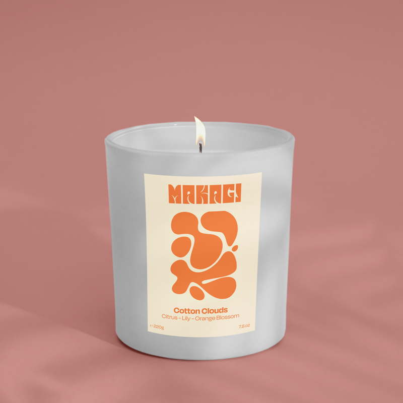 Fragrance candle in the glass of Cotton Clouds - citrus, violet & orange blossom