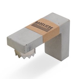 Rectangular soap holder made of wood or concrete, includes 2 bars of soap from the BADELIEBE range, priced at 20.95 euros.