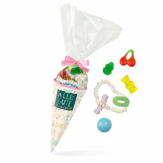 Sac de sucre inscription scolaire rose mélange de bonbons colorés