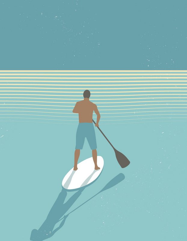 Paddleboarder o zachodzie słońca