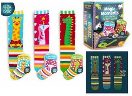 Phosphorescent magic socks, colorful striped, glow in dark, assorted animal designs, one size.