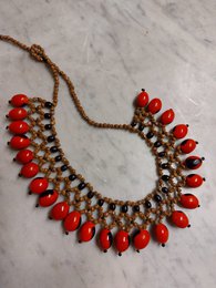  "Red teardrop beads, brass accents, braided cord, bohemian tribal necklace, ethnic handmade style"