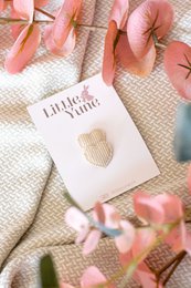 Beige corduroy hair clips in the shape of hearts, featuring a textured surface and a subtle striped pattern.