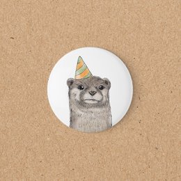 Otter wearing party hat, round magnet, celebration design, cute animal illustration.